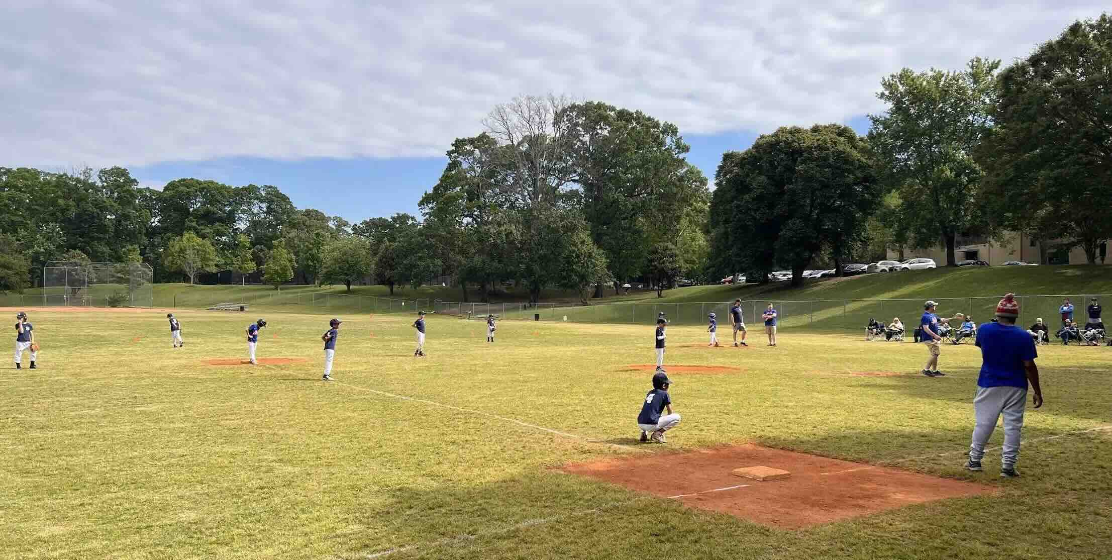 A local baseball team in Grant Park Atlanta Georgia plays a game during their Spring Baseball season.